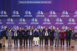 Narendra Modi takes a group photo with AI company leaders during the India AI Impact Summit.